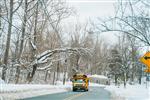 Schoolbus driving on snowy day