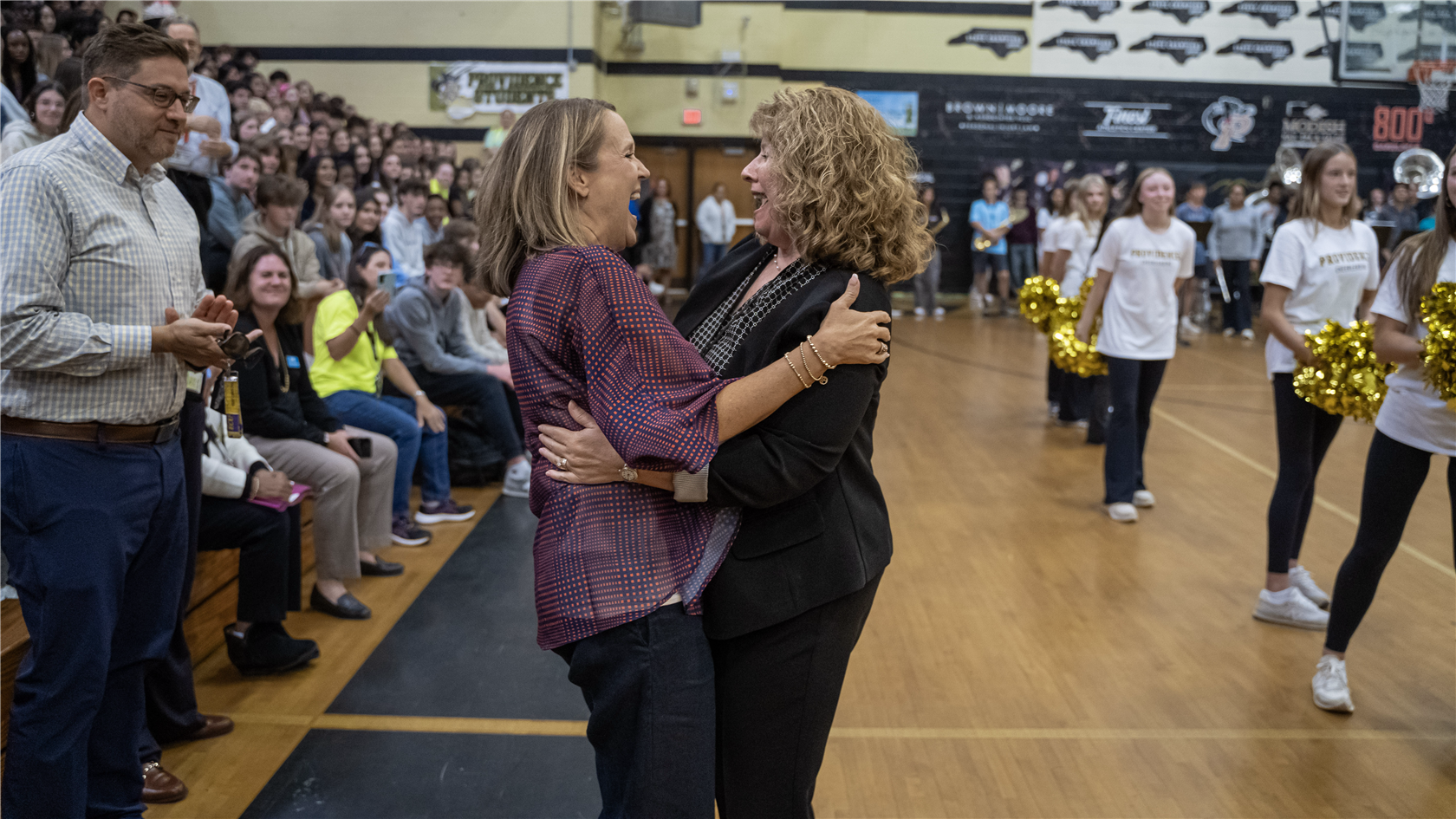 Dr. Tracey Harrill, and Principal Jamie Brooks sharing a moment 