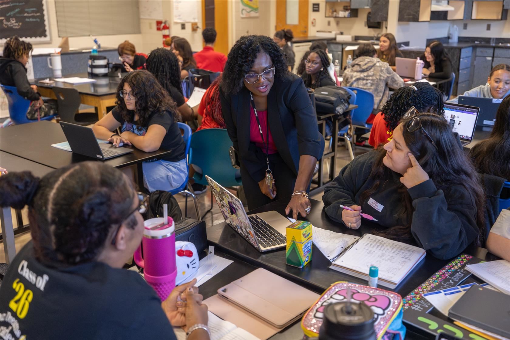 POB Principal Tanya Branham talks with a group of students in a classroom