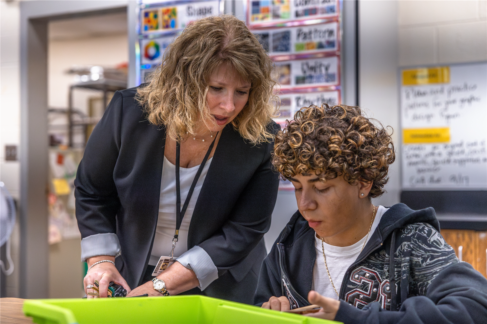 Principal Harrill talking with a student.