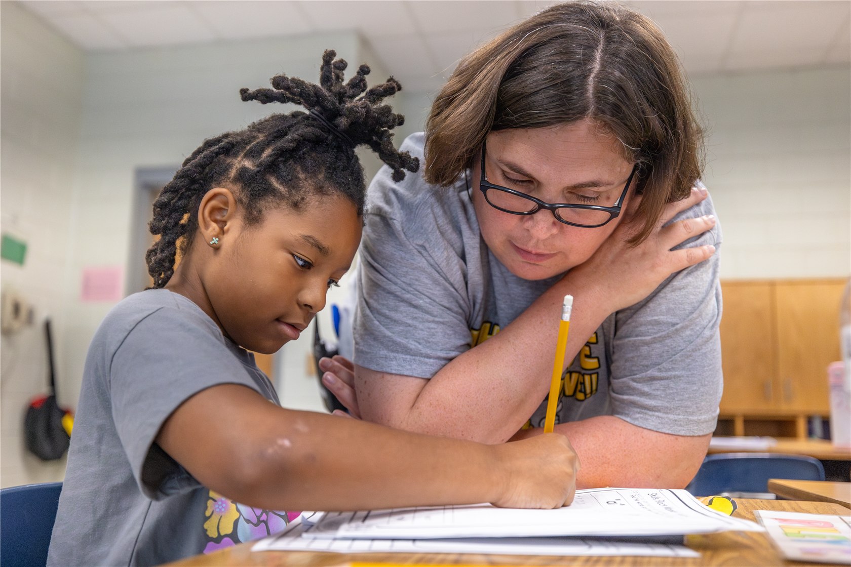 Principal Range watching a student work