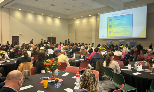  Approximately 150 partners gather in a meeting room at Friendship Missionary Baptist Church.