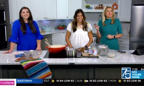  Elizabeth Barrick (center) stands between two WBTV reporters as she gives a cooking demonstration.